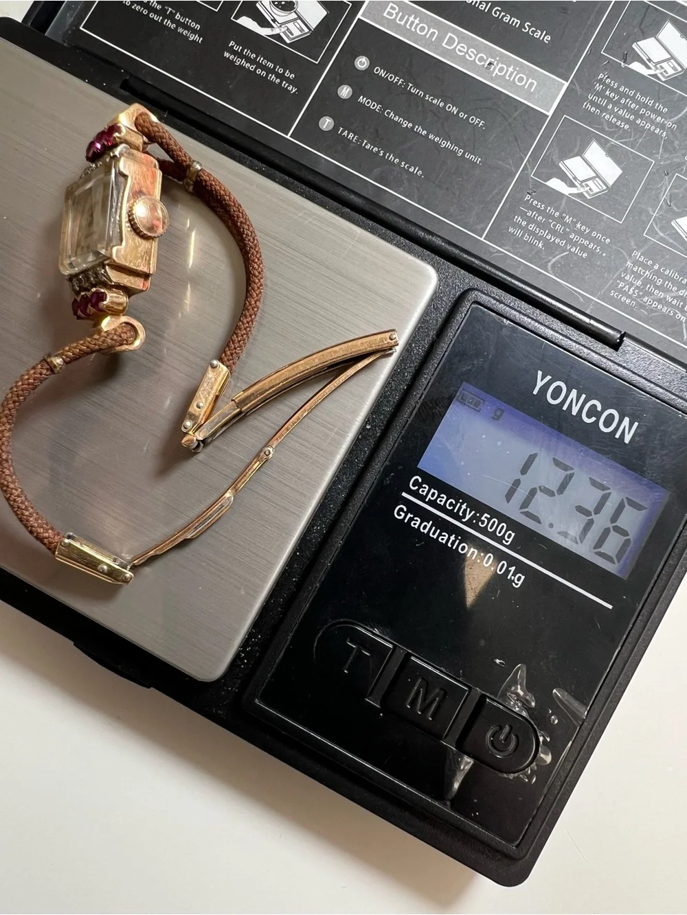 Gruen Precision wristwatch crafted in 14k rose gold with rubies and diamonds